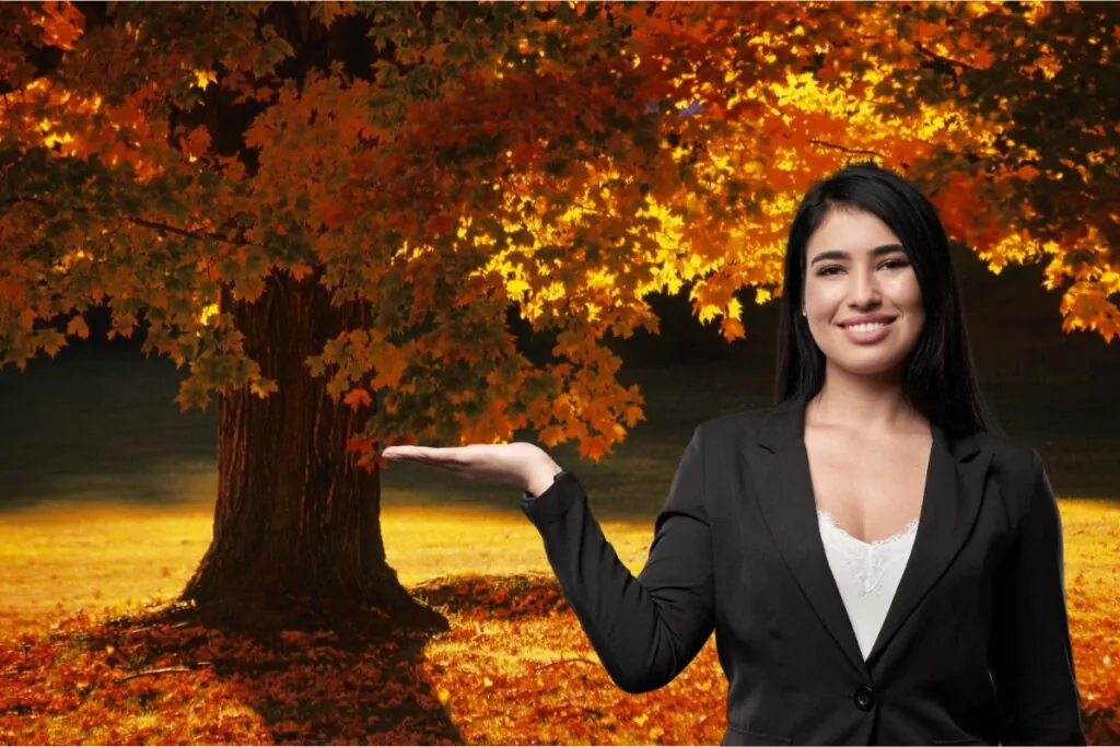 woman showing maple tree